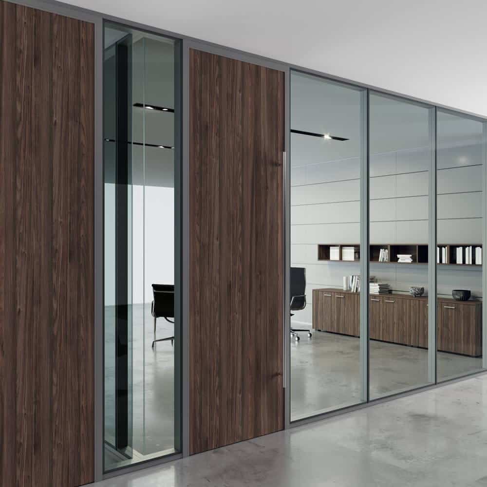 Five BRIDGE modular glass wall panels in glass and wood finish for a textured office aesthetic.