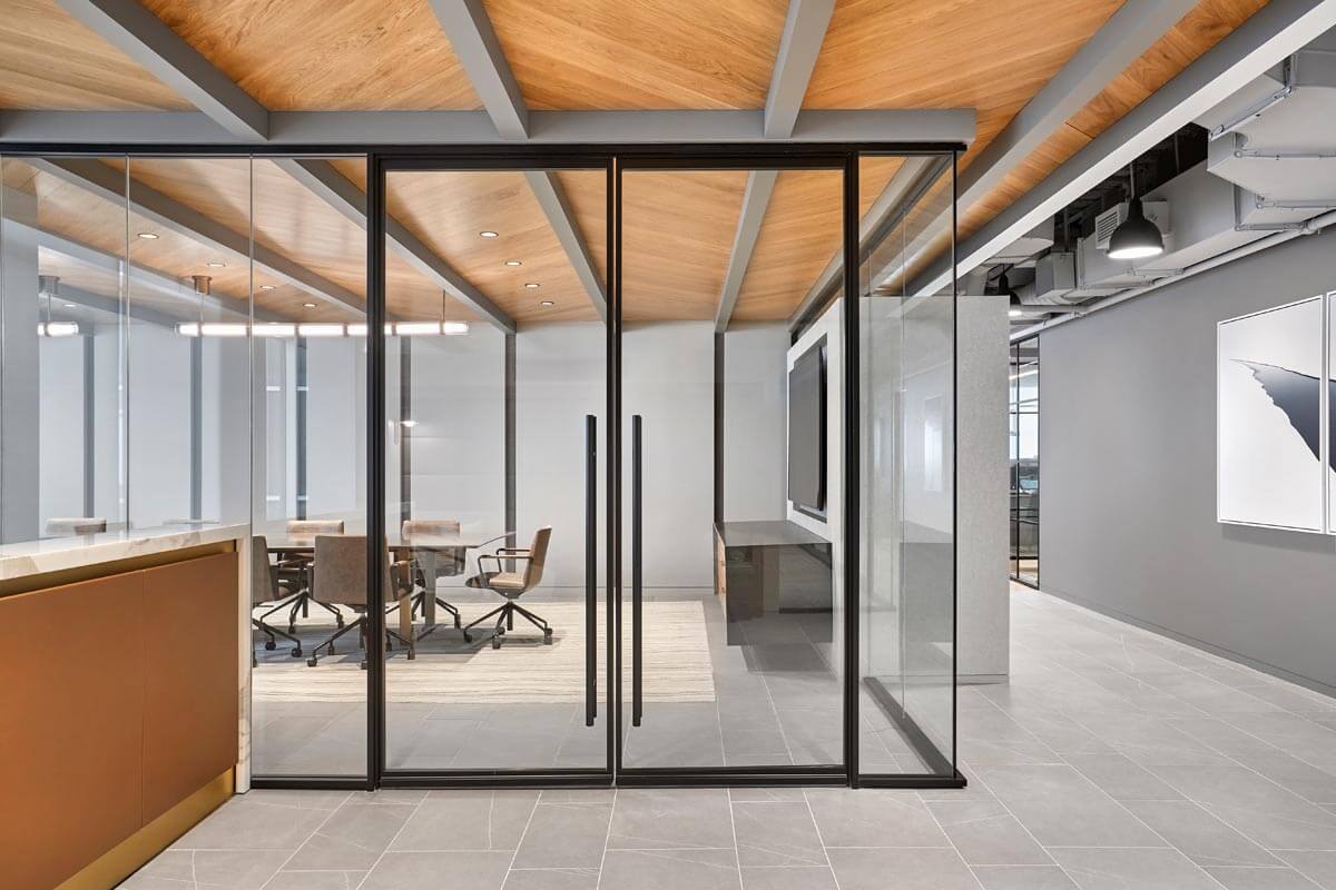 ONE LP office partition walls with framed double pivot doors.