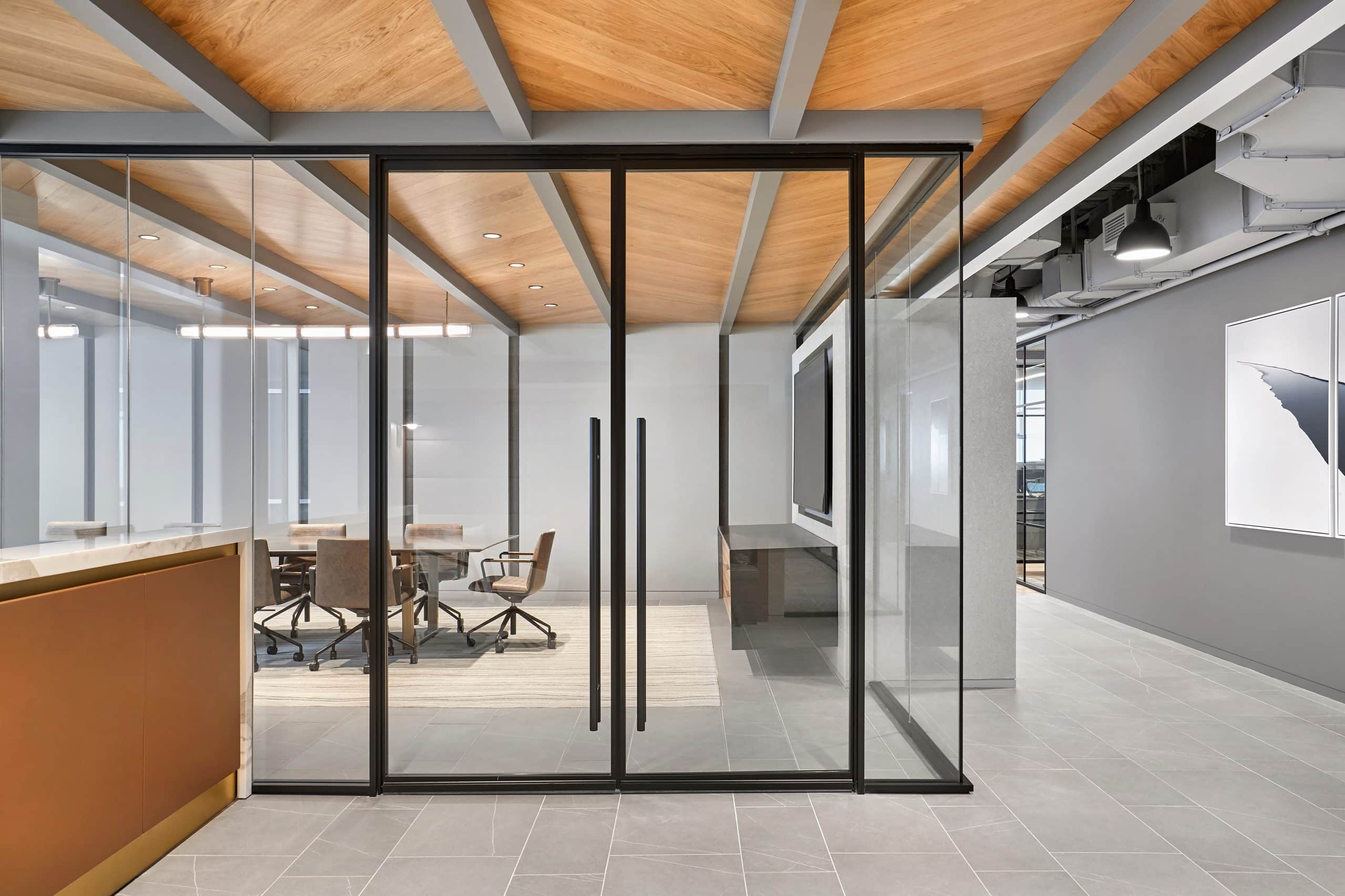 Hallway of offices designed with Transwall One LP flexible office wall system