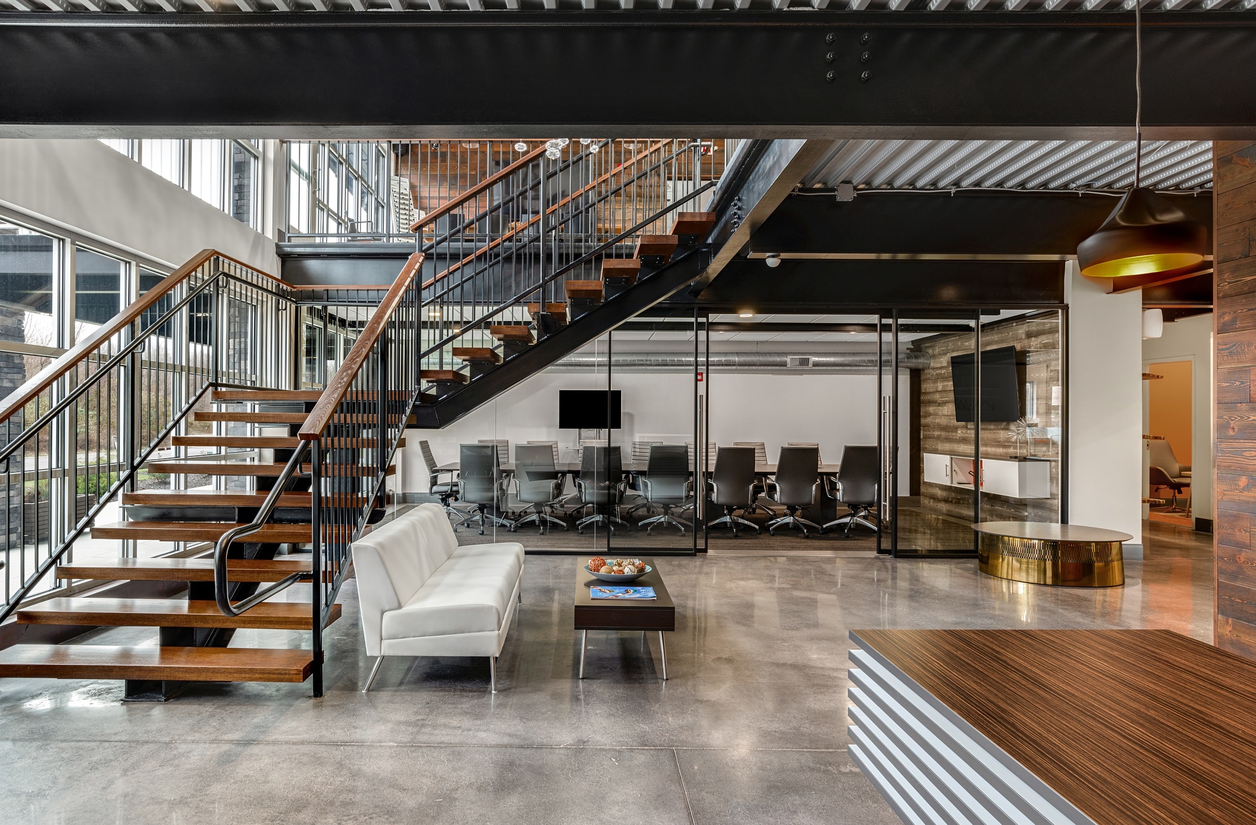 Lobby with staircase in foreground and conference room in background